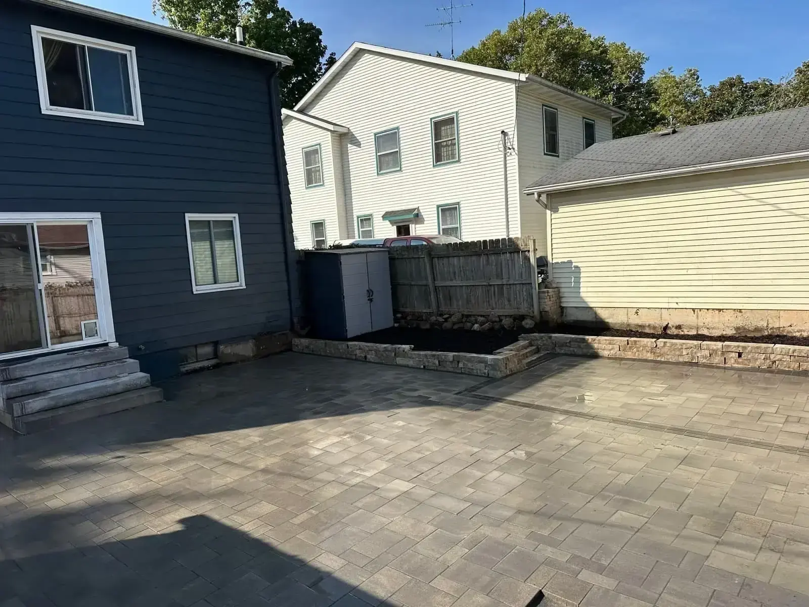 Custom paver patio installation by Jack of All Blades Grand Rapids MI