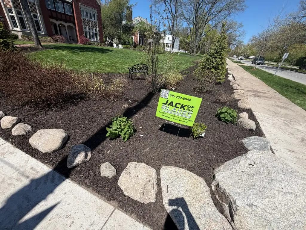 Front yard landscape design with mulch and boulders Grand Rapids MI